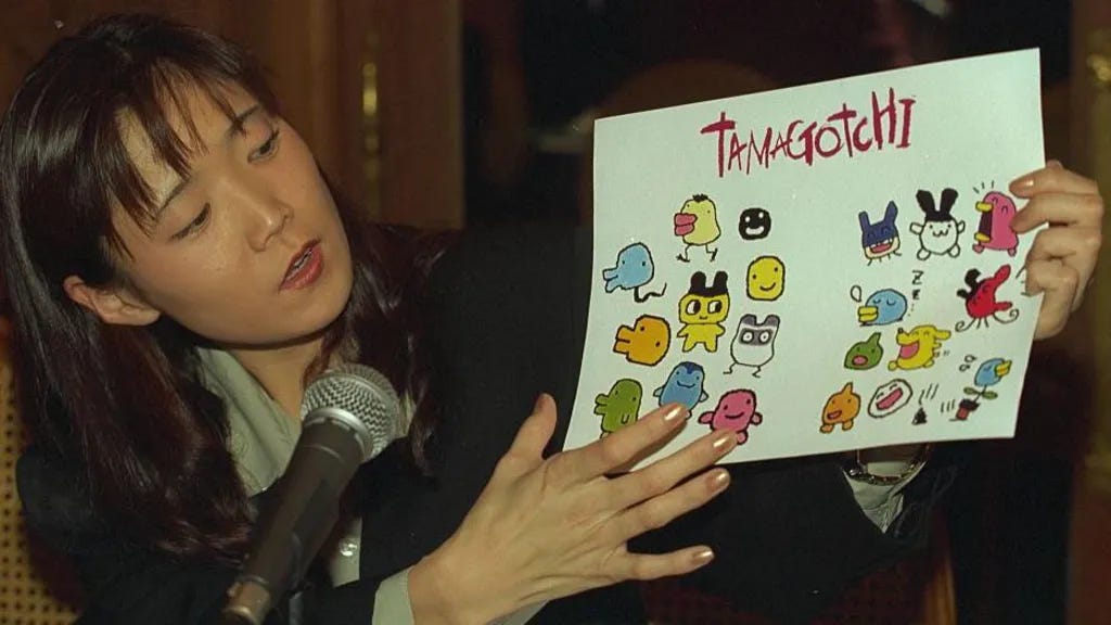 Aki Maita presenting the Tamagotchi.