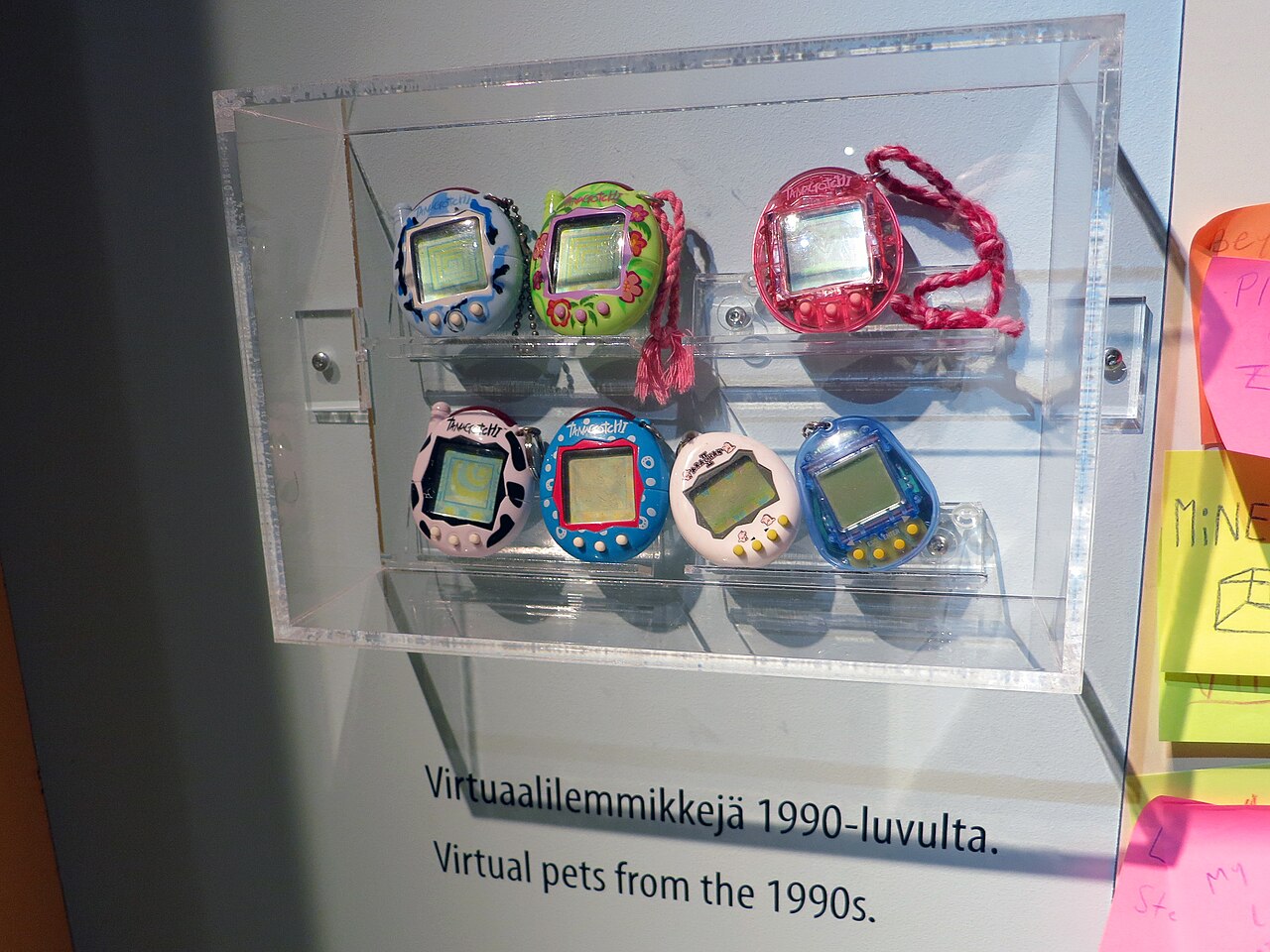 Some older Tamagotchi models from the 1990s on display at the Rupriikki Media Museum in Tampere, Finland.